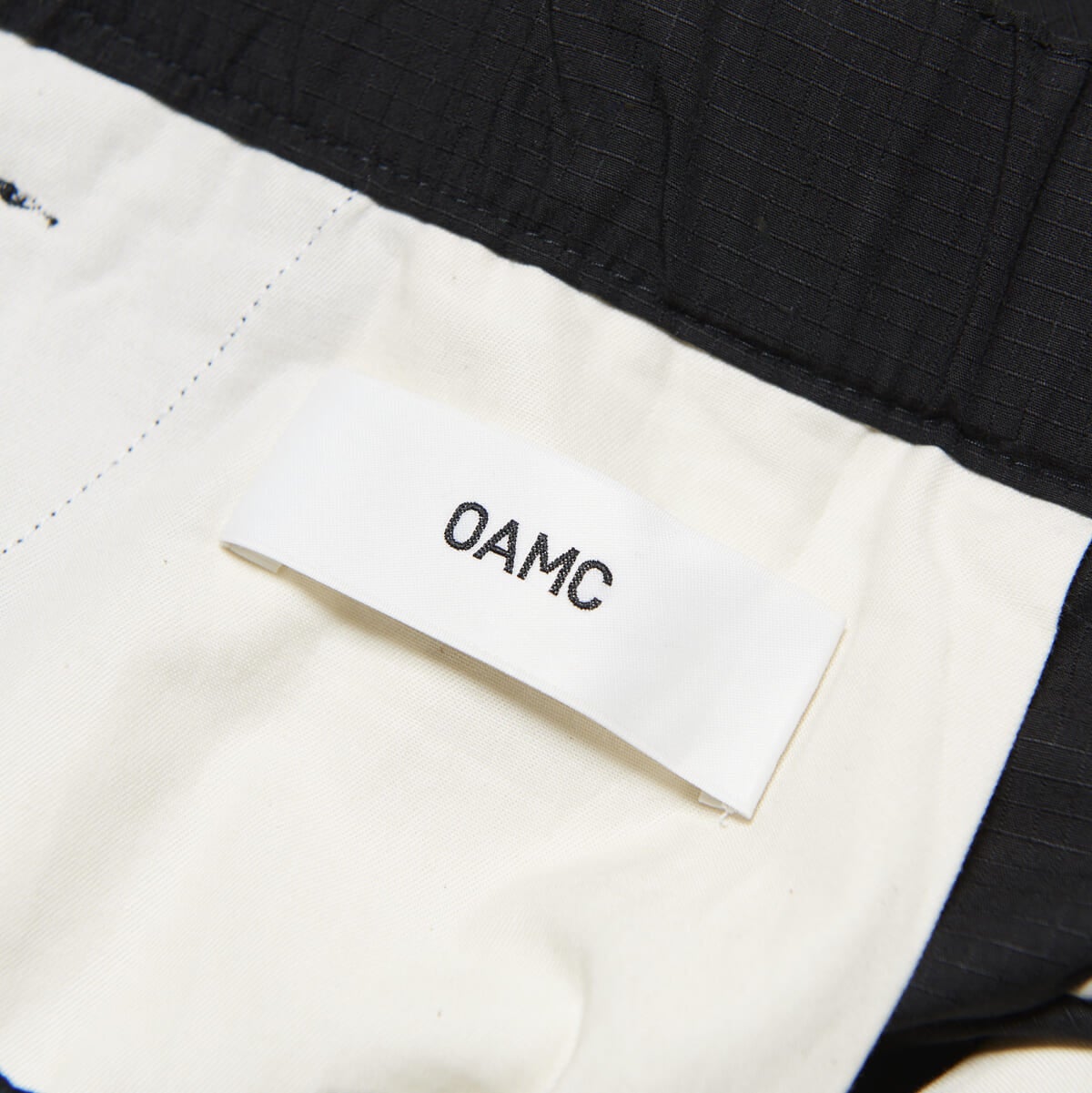 OAMC × Editionの別注パンツ　ブラック　タグ