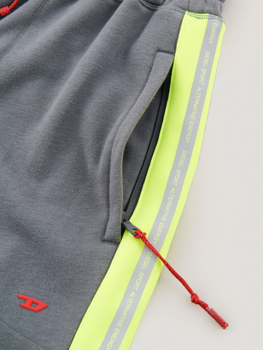 ディーゼル スポーツの Sweatpants with reflective logo bands　スウェットパンツ　サイドポケット