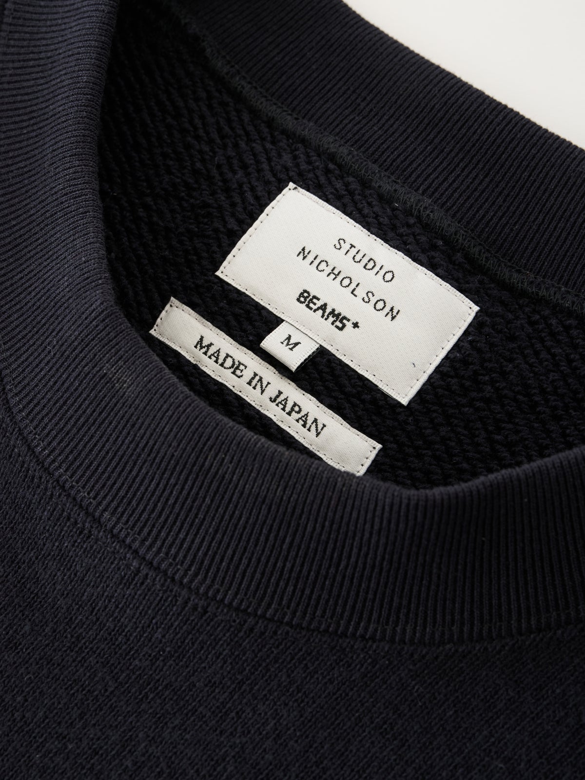 スタジオニコルソンとビームスプラスのコラボ/GOLIGHTLY JERSEY SWEAT タグ