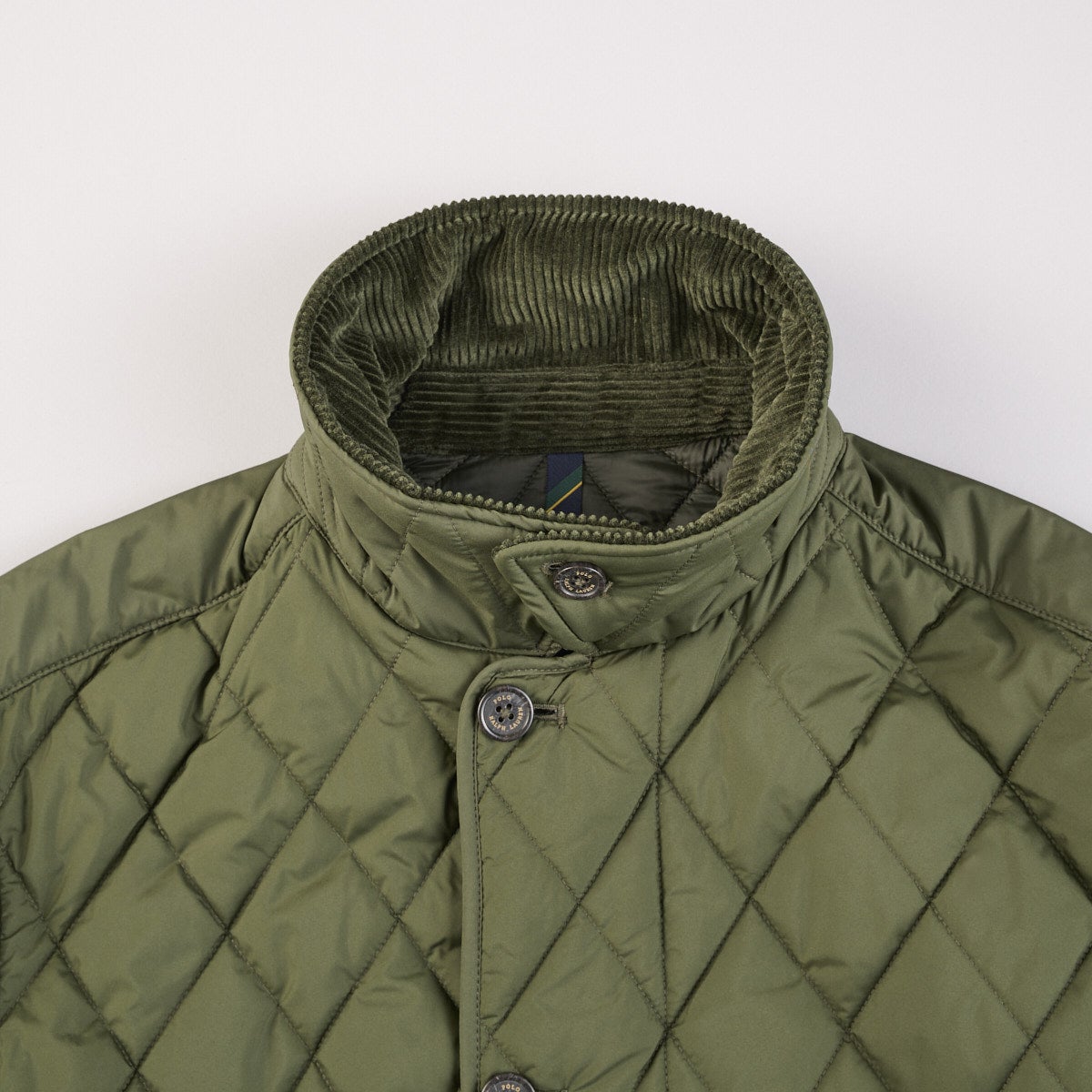 ポロ ラルフ ローレンのキルテッド カー コートのスタンドカラー