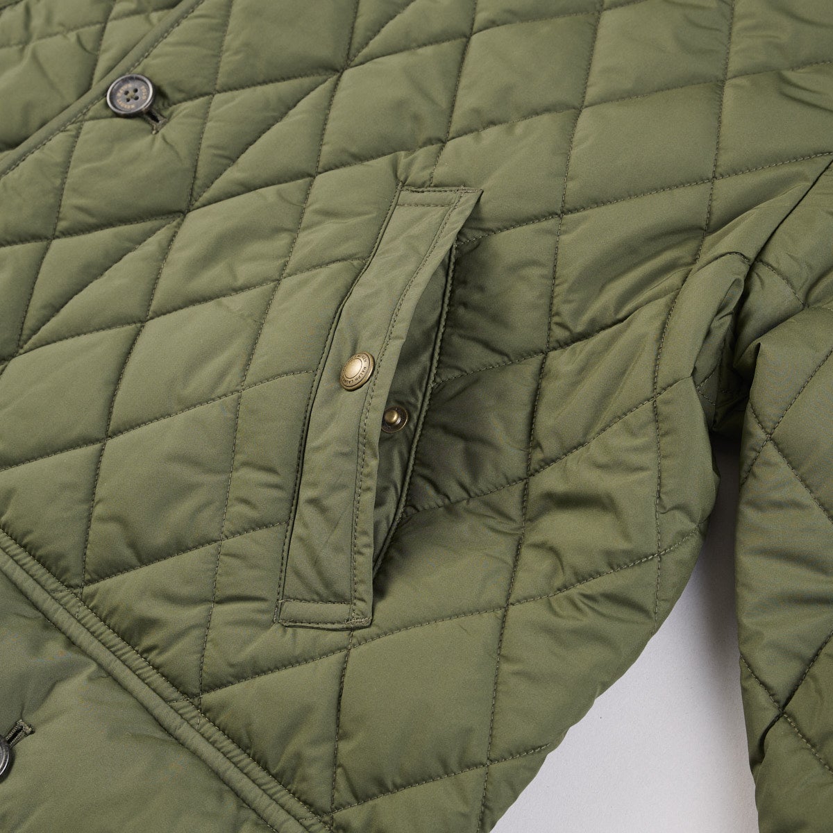 ポロ ラルフ ローレンのキルテッド カー コートのサイドポケット