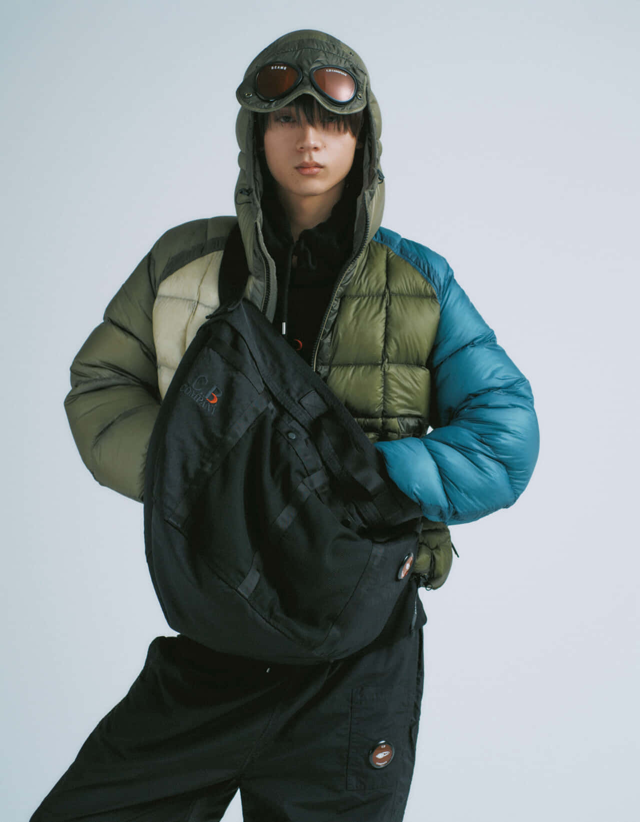 水沢林太郎が着用するC.P. Company × BEAMSのダウンジャケット