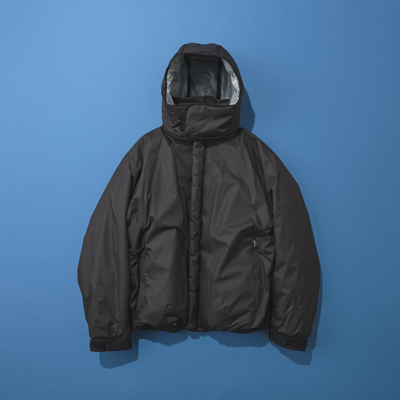 ゴールドウィン ゼロの黒いウィンドストッパーモパデッドジャケット