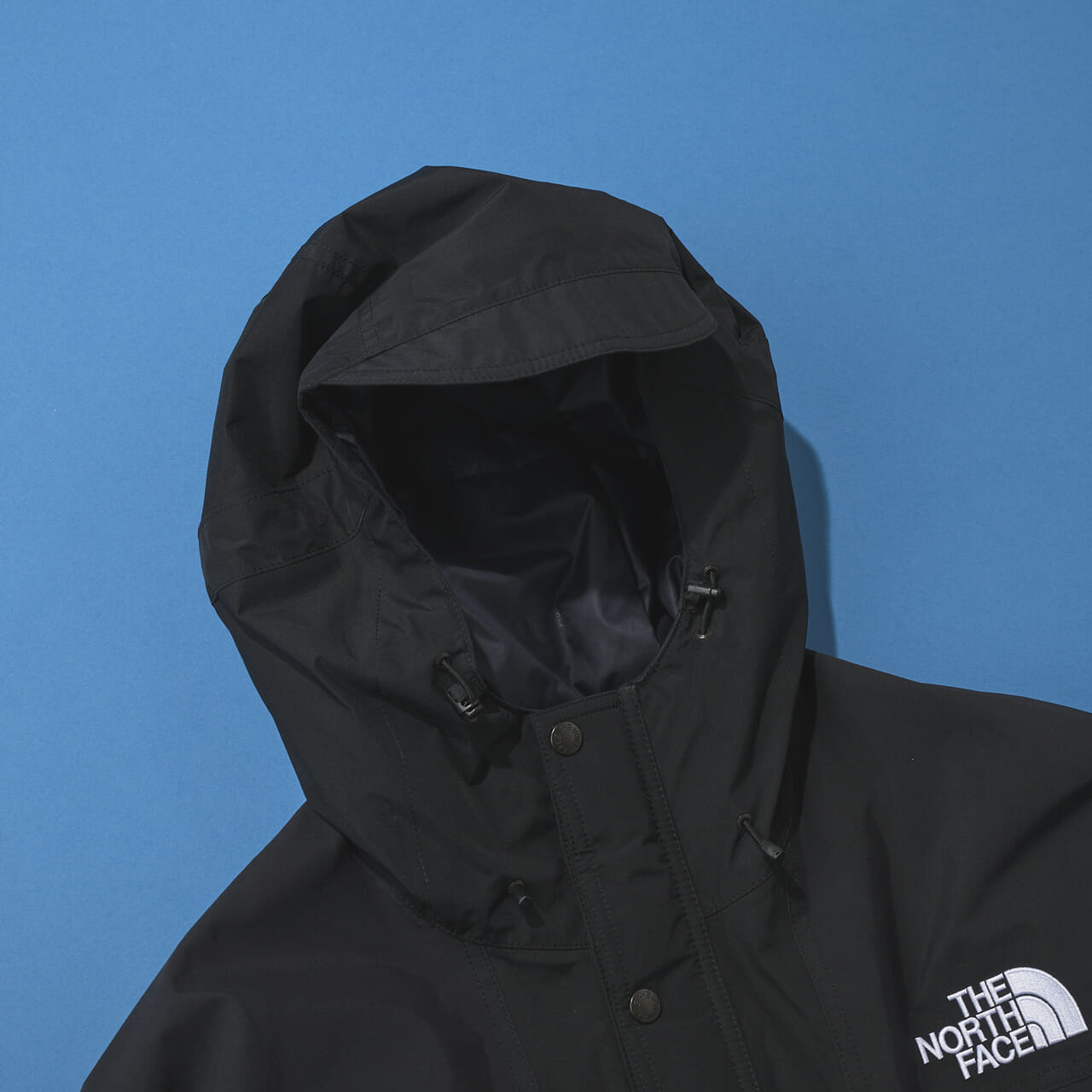 ザ・ノース・フェイスの黒い中綿ジャケット/マウンテンインサレーションジャケットのフード