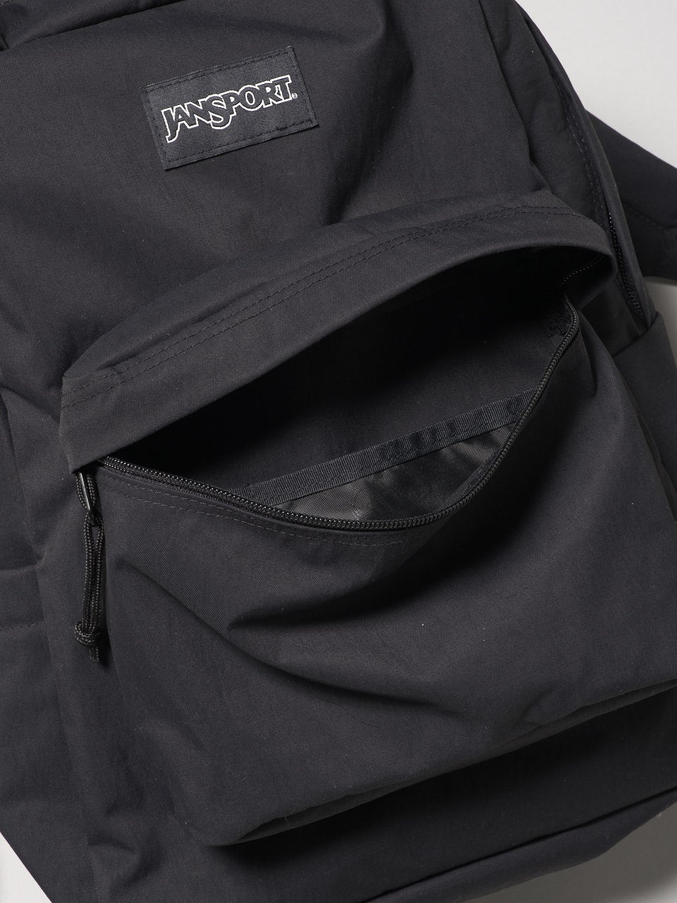 ジャンスポーツ、黒バックパック、フロントポケット