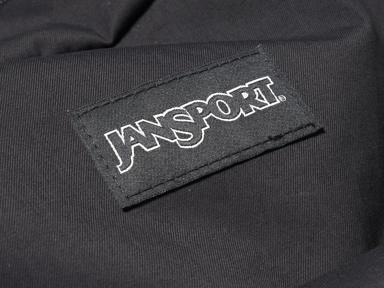 ジャンスポーツ、黒バックパック、ロゴ