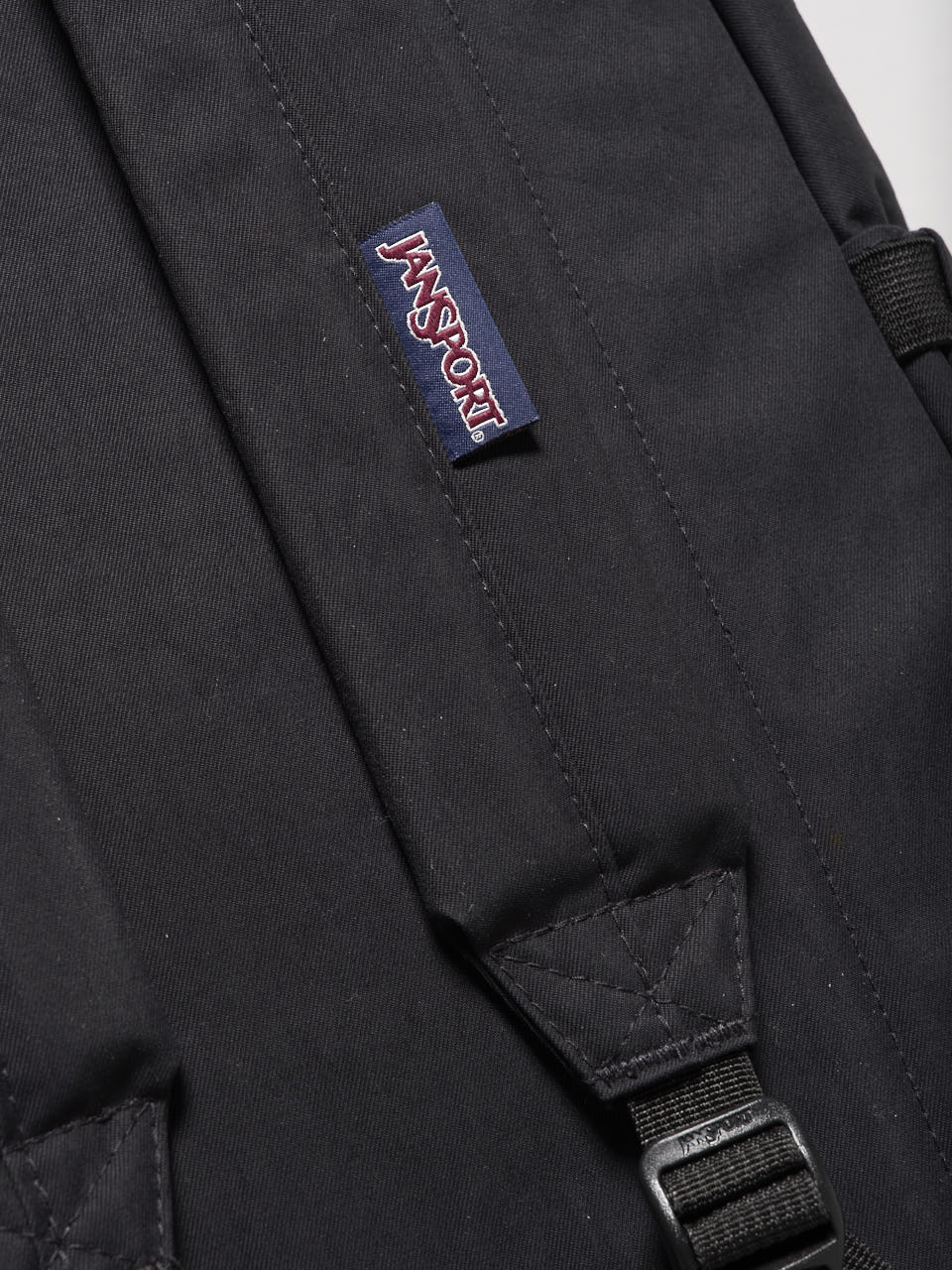 ジャンスポーツ、黒バックパック、ショルダーロゴ