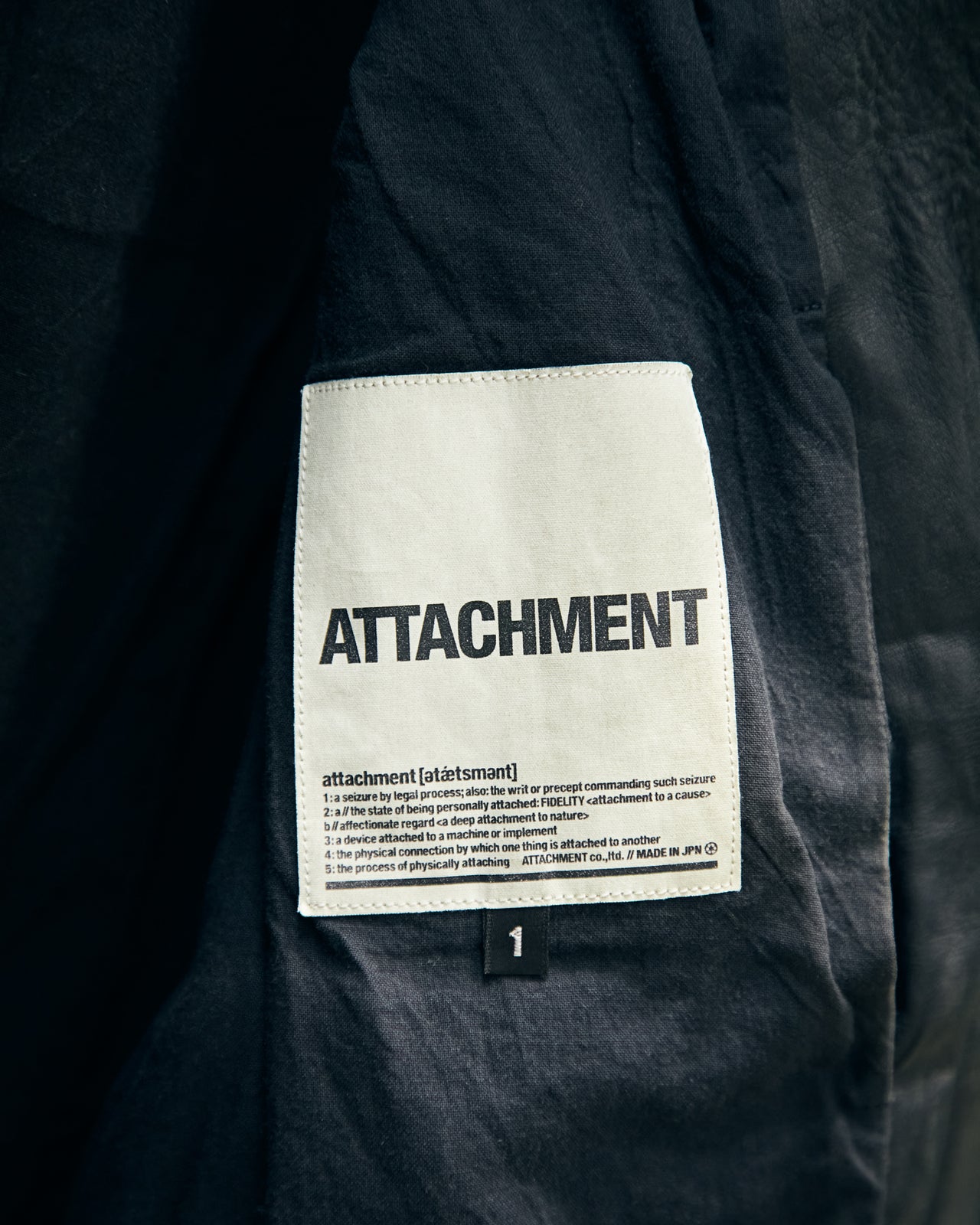 榎本さんが入社した当時のATTACHMENTの織りタグ