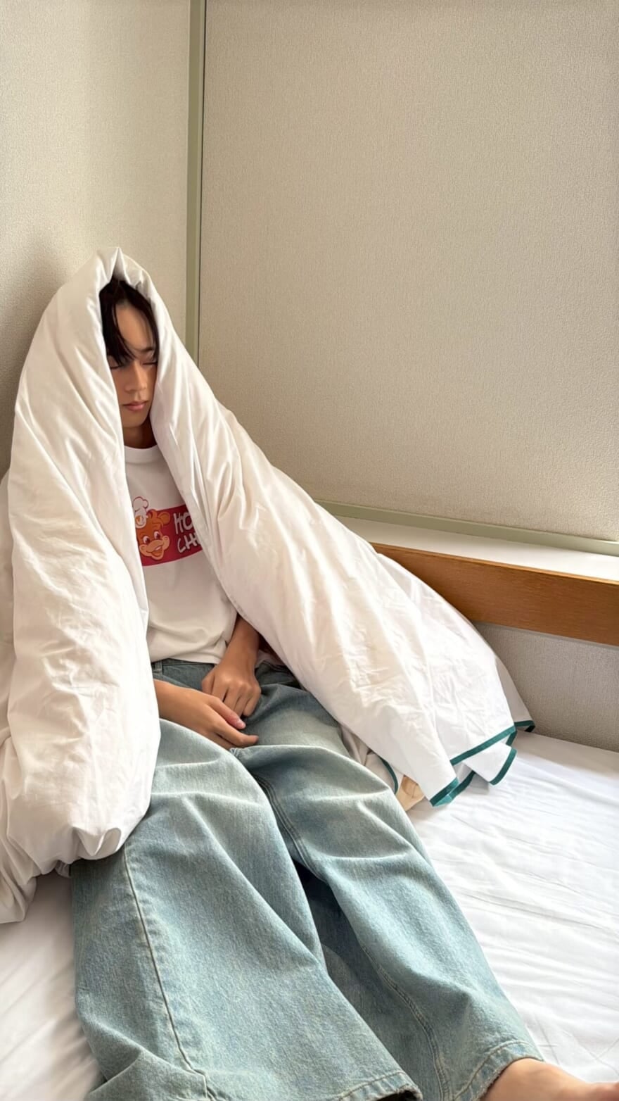 布団を被った水沢林太郎