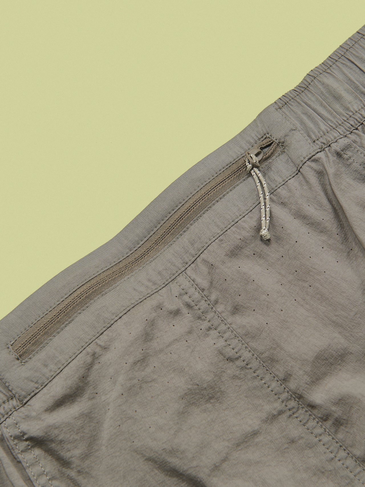 ザ・ノース・フェイスのGAR ウインドパンツのウエストのファスナーポケット