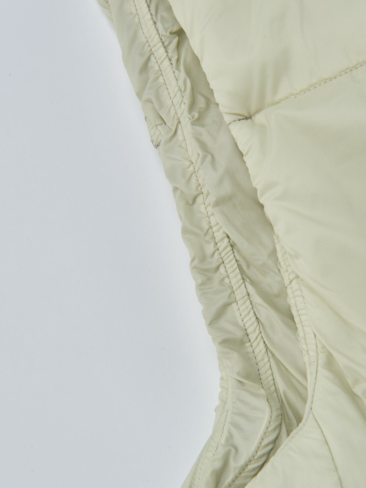 OUR LEGACY WORK SHOP&times;Goldwin、インサレーテッドベスト、脇