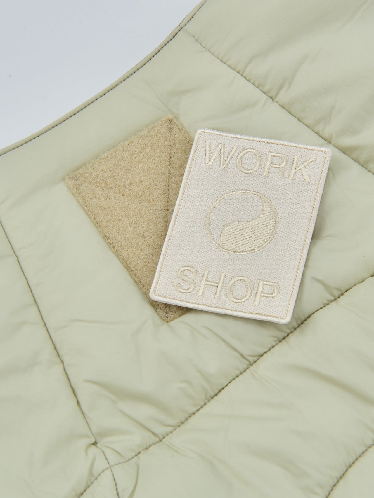 OUR LEGACY WORK SHOP&times;Goldwin、インサレーテッドベスト、バックタグ