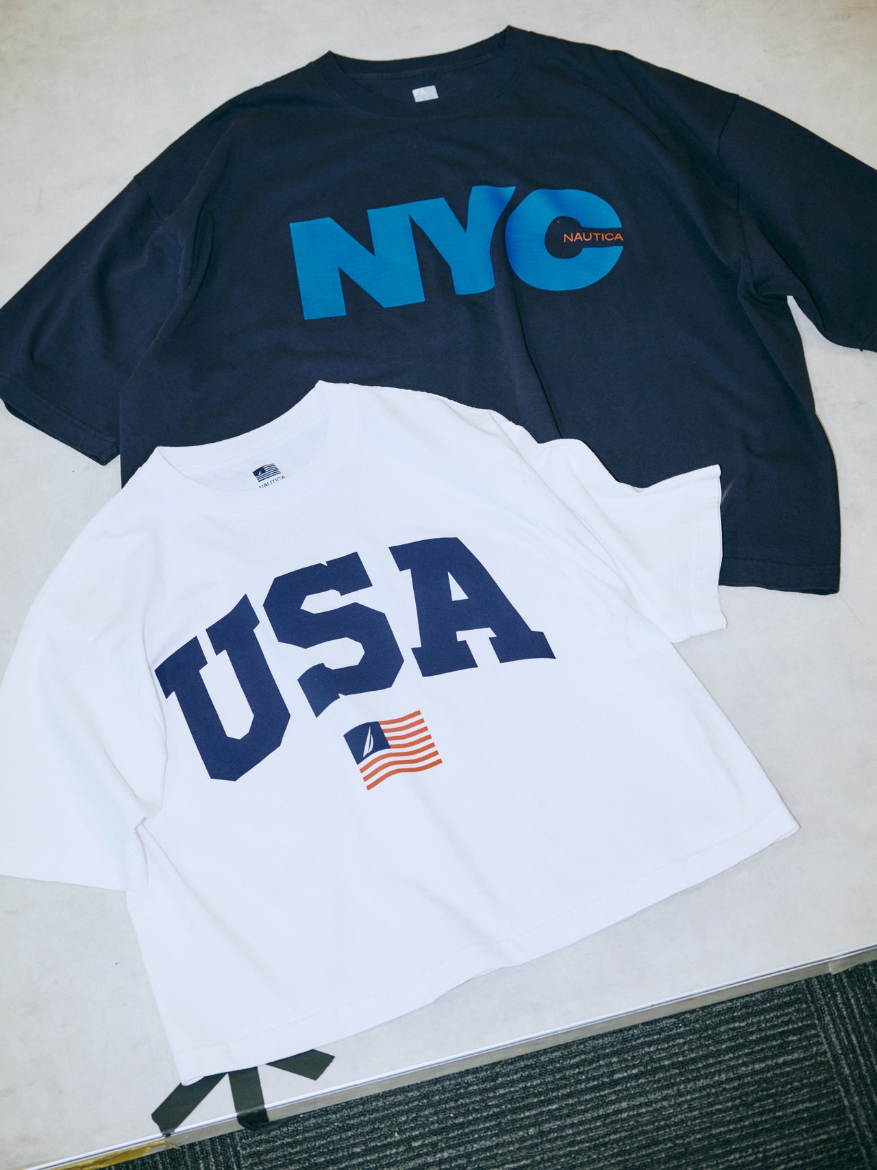 〈NAUTICA〉のTシャツ